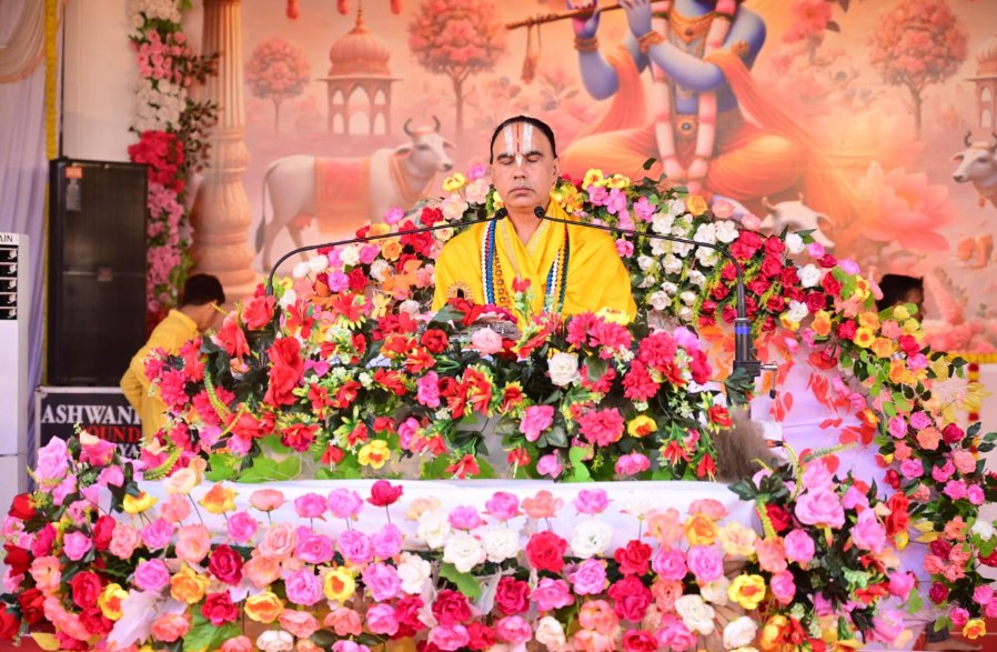 Sant seated in meditation on a floral stage