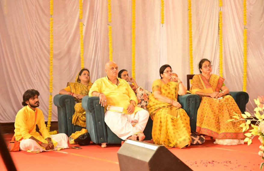 Family seated together during the katha