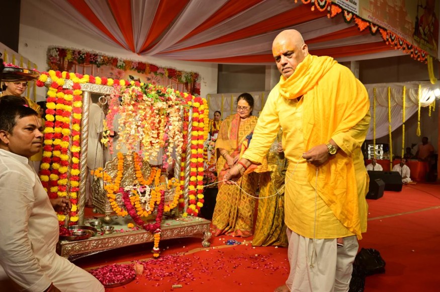 Deity swing being decorated with garlands