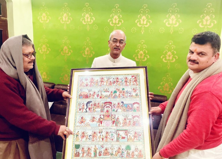 A traditional painted scroll being presented